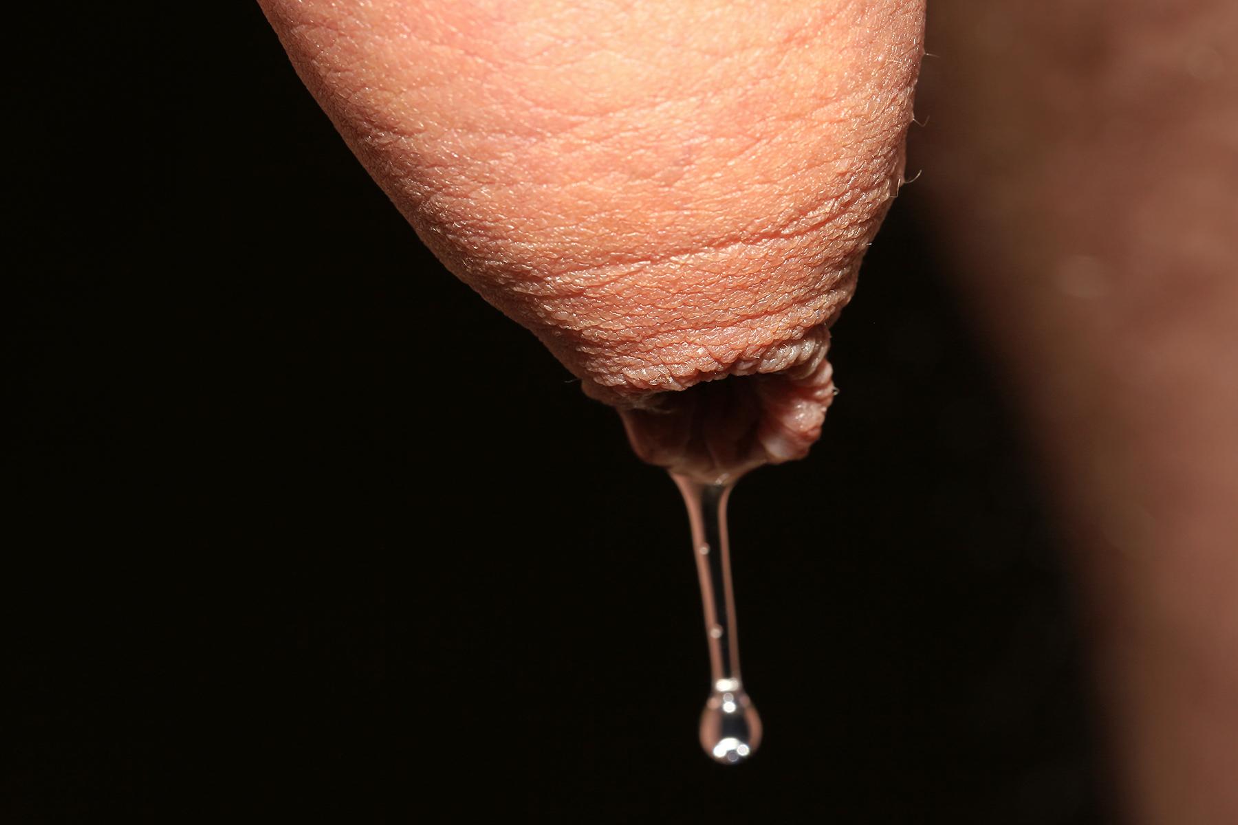 File:Precum dripping from penis.jpg - a close up of a person's tongue with a drop drop drop drop dro
